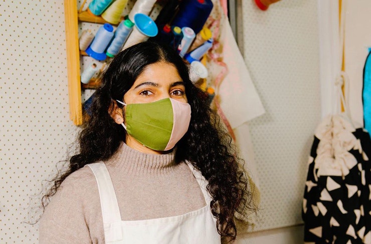 A woman wearing one of the Second Stitch face masks.